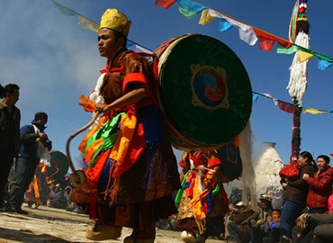 Monks perform a traditional religious dance.