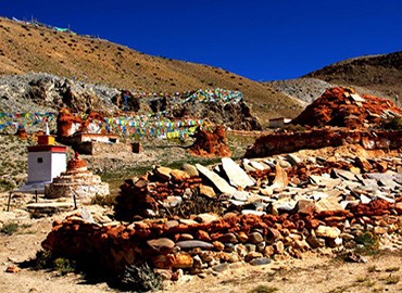 Outside Trithapuri Monastery, there's a large circle of mani stones marking the spot.