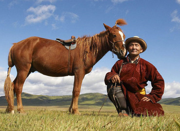 Tibetan Nomads with their horse. Tibetan Nomads with their horse.